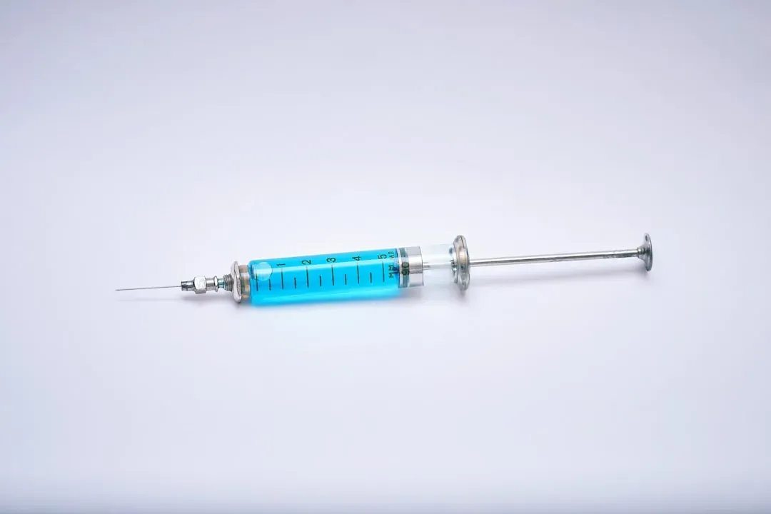 Peptide injection vial and syringe setup for testosterone-boosting compounds like Ipamorelin, CJC-1295, and GHRP-6 on medical